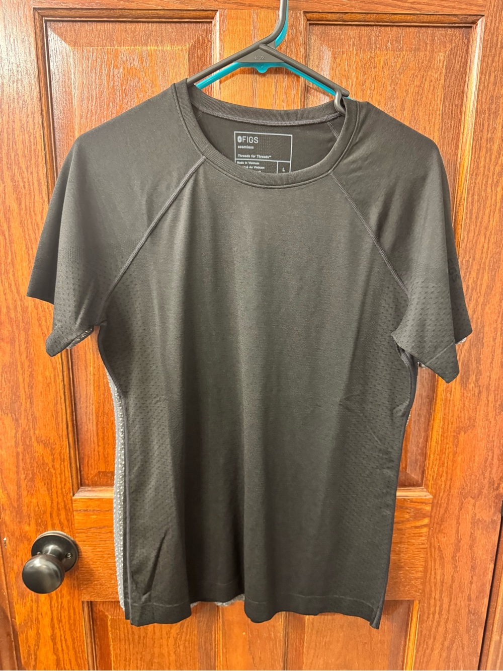 FIGS Salta Short Sleeve. Color is black. Size Large. NWOT.